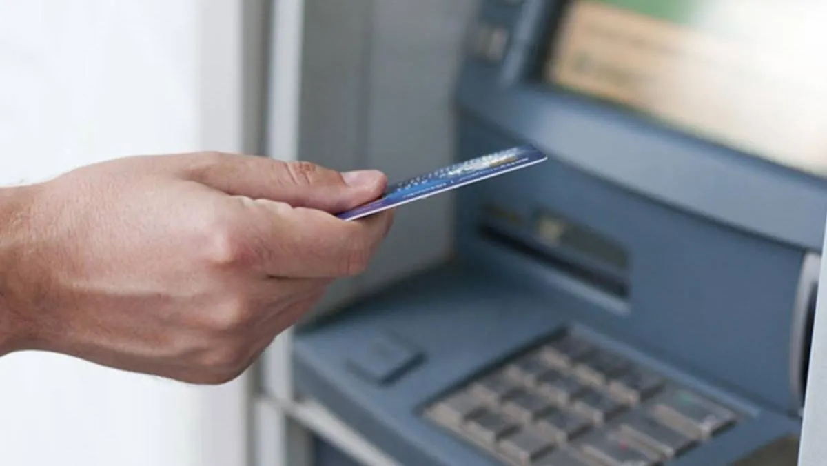 Interoperable cardless cash withdrawal