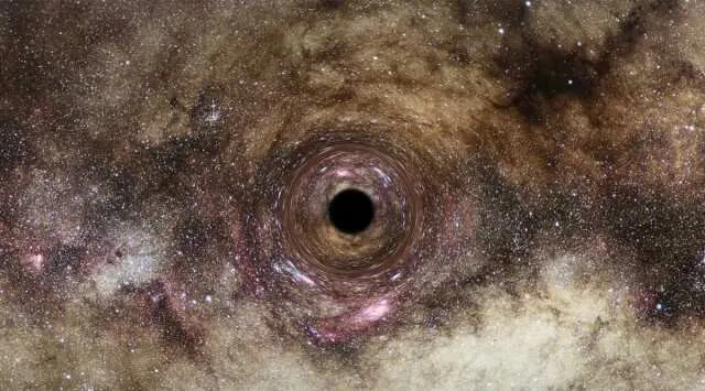 One of the biggest known black holes discovered due to its light-bending gravity